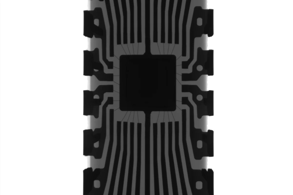 An X-ray image of an Arduino chip showing its fine bonding wires.