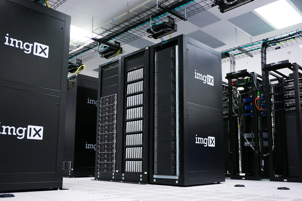 Rows of black server racks inside a data center.