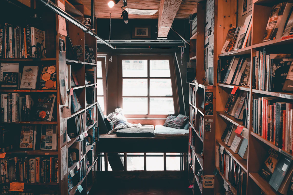 Bookshelves and reading space inside a cozy bookstore.