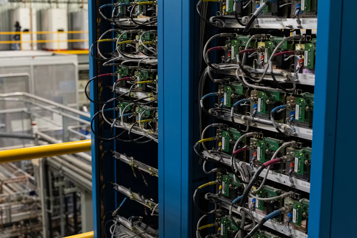 Equipment racks filled with electronic instruments and connecting wires.