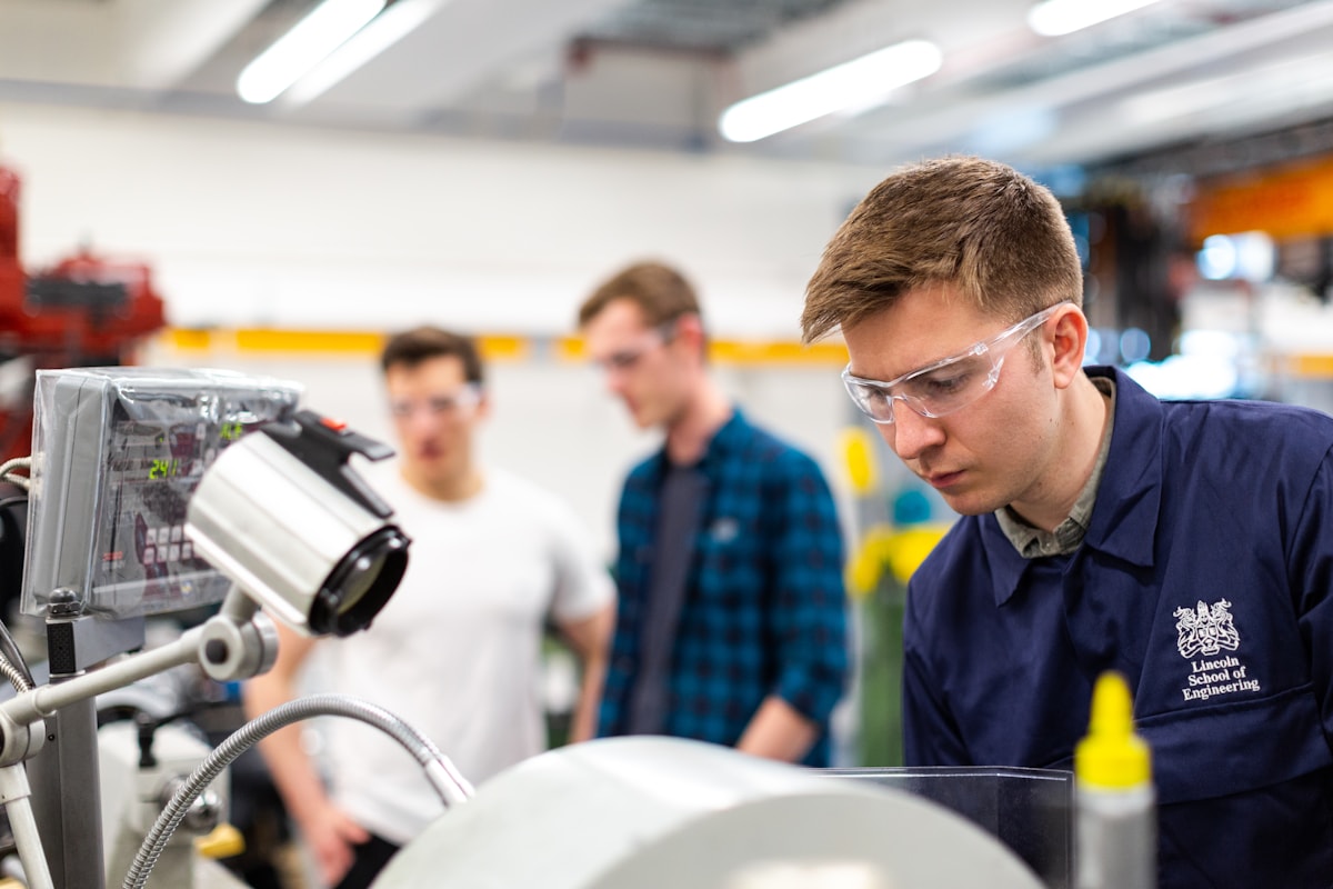 Engineer inspecting equipment in a production facility